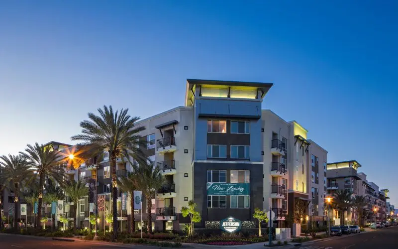 A building with palm trees in front of it